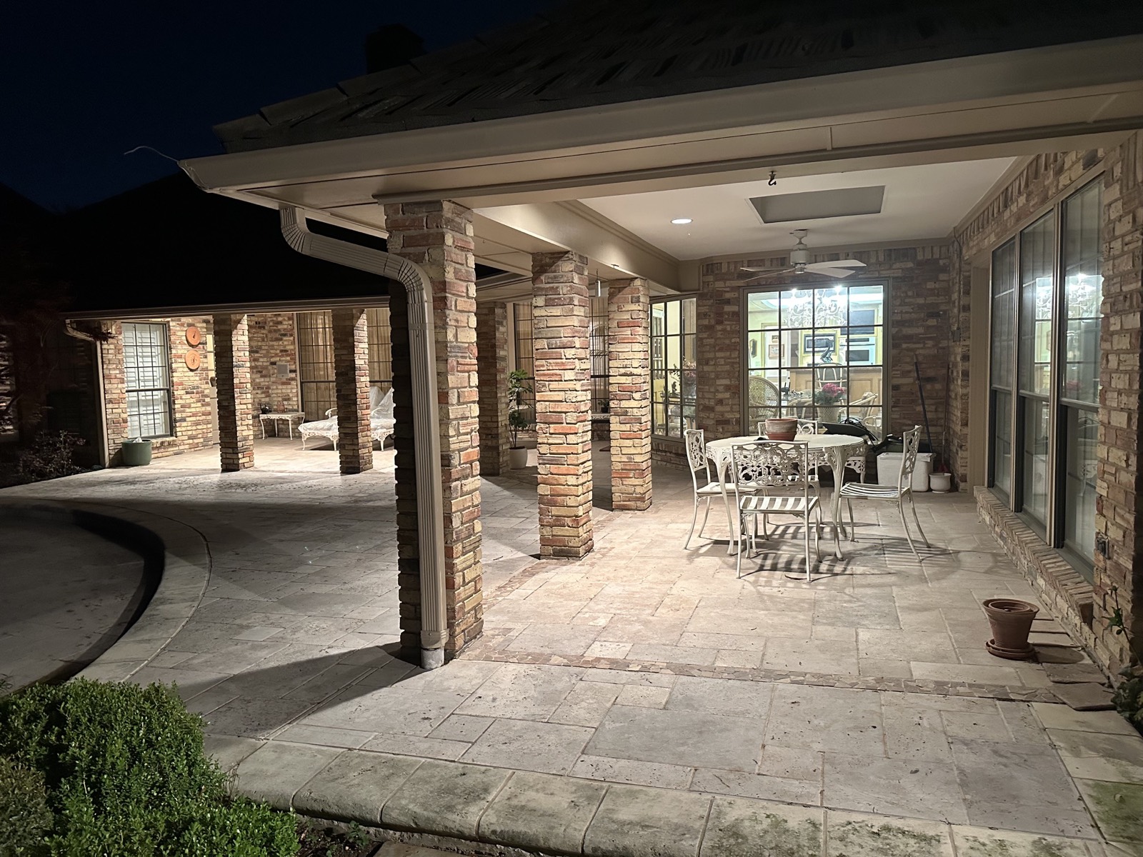 Covered patio dining set at dusk