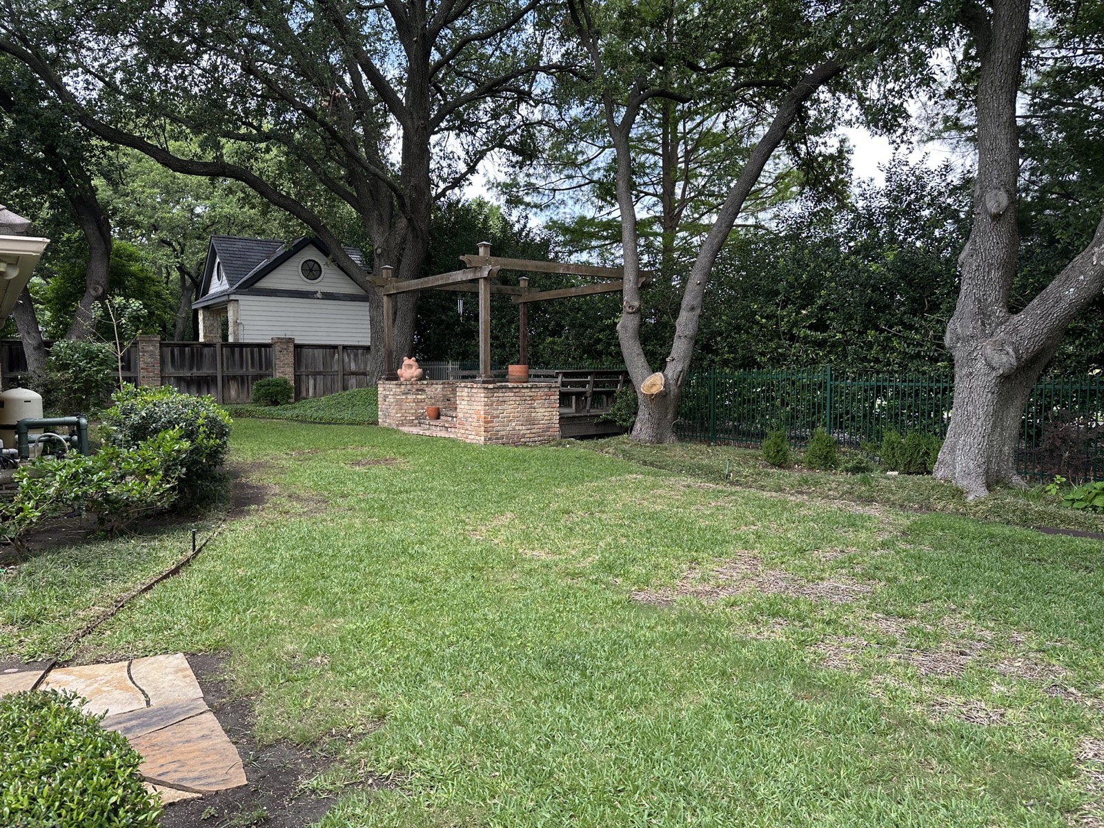 Brick and plank gazebo in the backyard