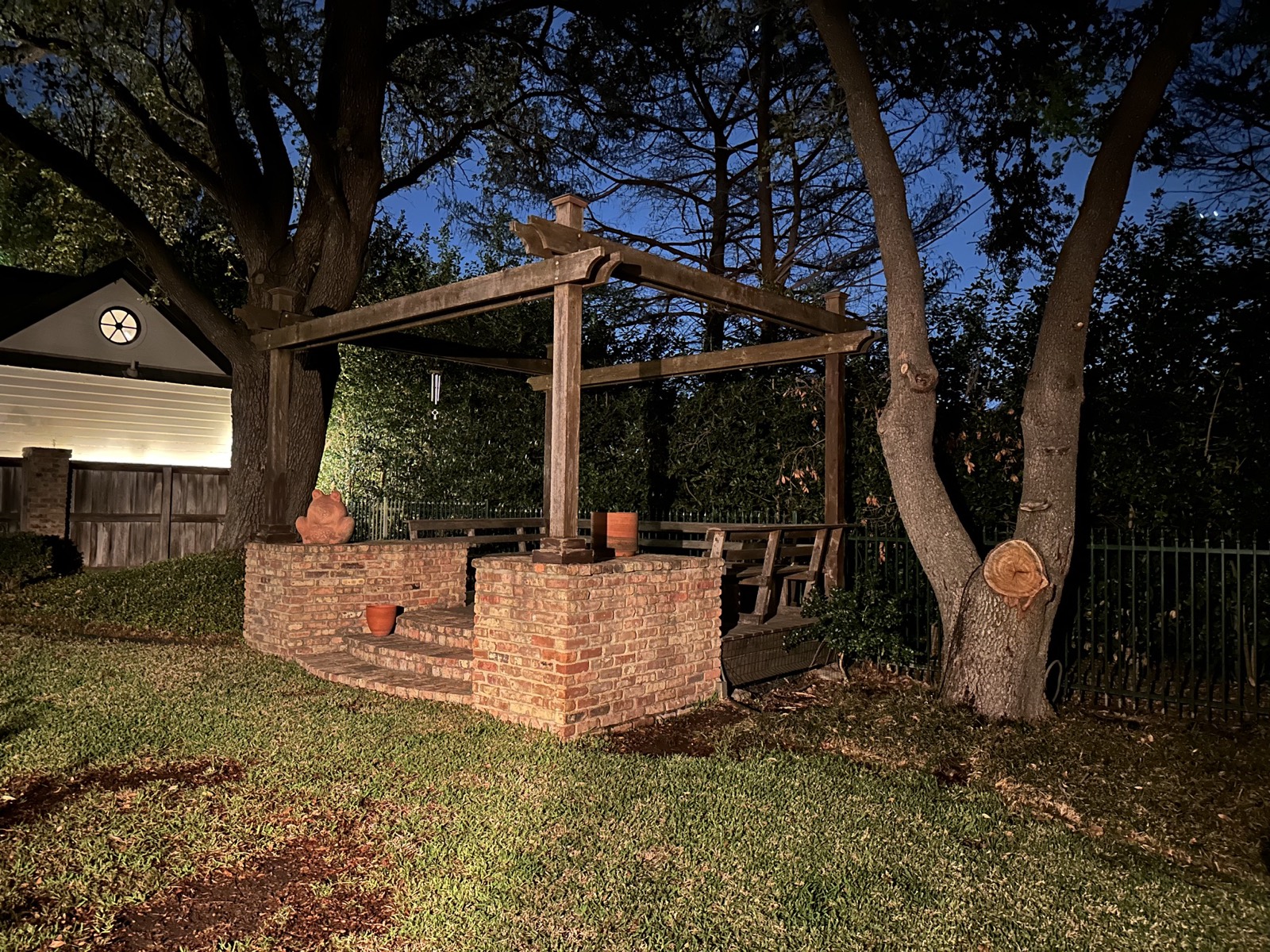 Gazebo sitting area lit at dusk
